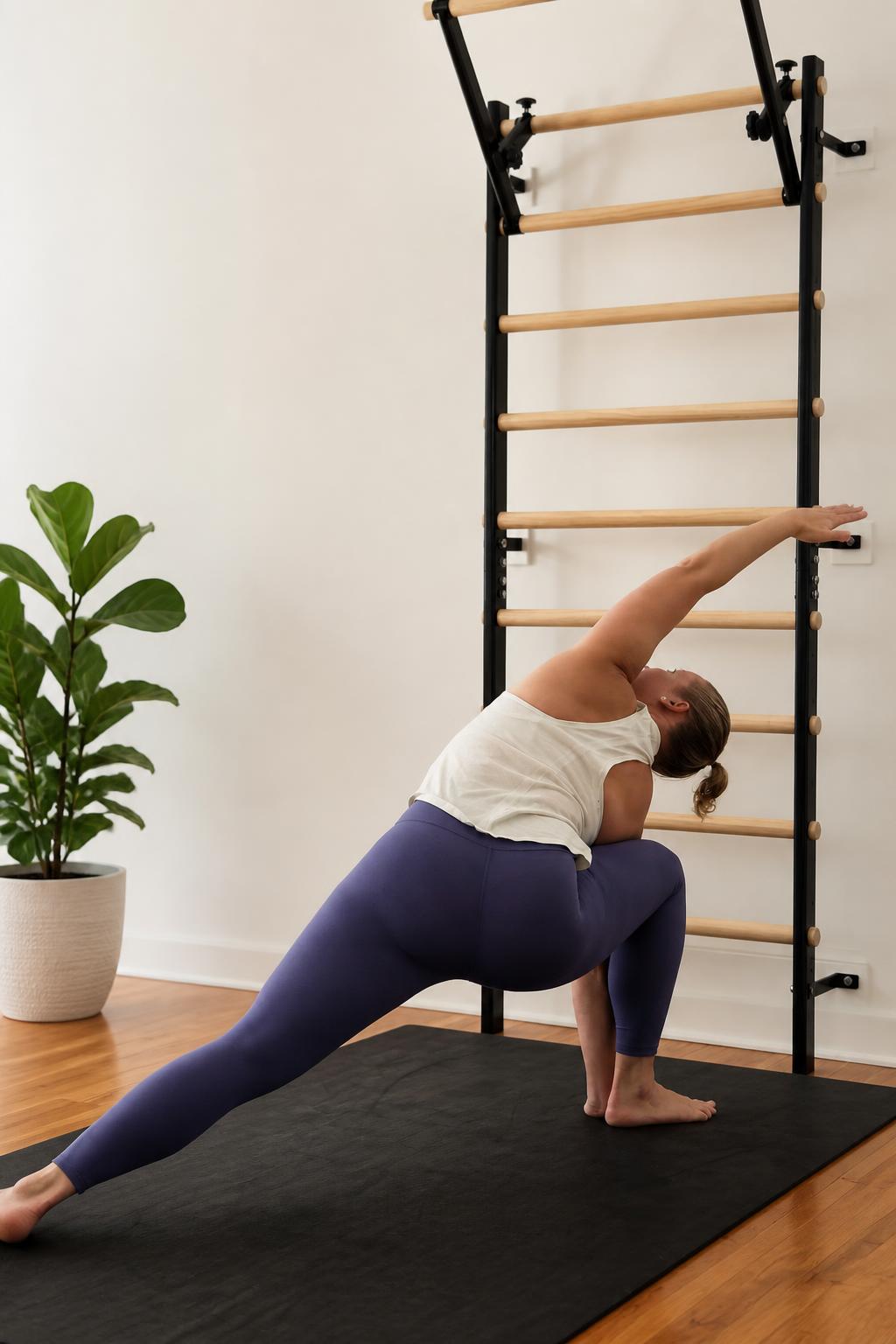 Natalie demonstrating a side-angle yoga stretch